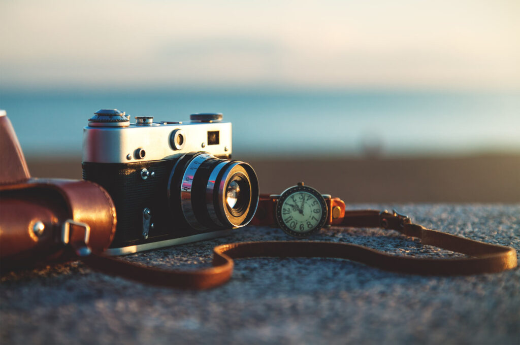 Photo of vintage camera at sunset in park