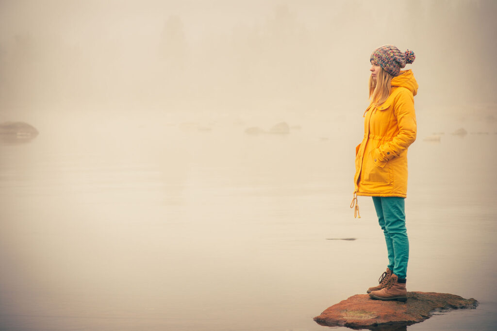 Young woman standing alone outdoo