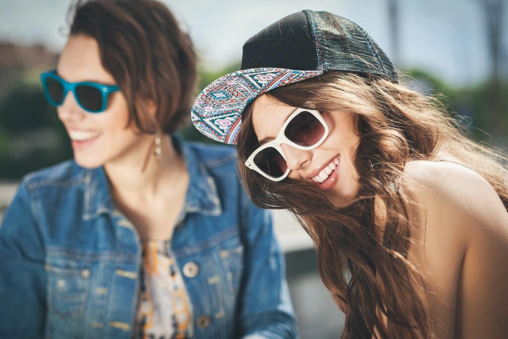 Two beautiful happy girls in sunglasses
